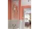 Elegant bathroom with peach walls, white tile and view through the doorway to the bedroom at 4705 Paran Nw Vly, Atlanta, GA 30327