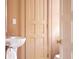 Cozy bathroom with unique pedestal sink and peach colored walls at 4705 Paran Nw Vly, Atlanta, GA 30327
