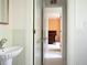 Charming bathroom with a view into a bedroom, featuring classic fixtures at 4705 Paran Nw Vly, Atlanta, GA 30327