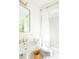 Bathroom with updated fixtures, including a pedestal sink, toilet, tub and shower at 4705 Paran Nw Vly, Atlanta, GA 30327