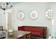 Bright dining room with round windows, a stylish chandelier, and an inviting built-in bench at 4705 Paran Nw Vly, Atlanta, GA 30327