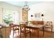Bright dining room with chandelier, wood table, and access to the garden at 4705 Paran Nw Vly, Atlanta, GA 30327