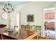 Spacious dining room with hardwood floors, chandelier and connection to kitchen at 4705 Paran Nw Vly, Atlanta, GA 30327