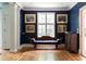 Stylish living room with bold blue walls, hardwood floors, and elegant furniture at 4705 Paran Nw Vly, Atlanta, GA 30327