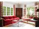 Bright living room boasts large windows, a comfortable sofa, and classic decor, creating a welcoming atmosphere at 4705 Paran Nw Vly, Atlanta, GA 30327