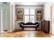 Sitting area with white walls, hardwood floors, decorative pillars, and natural light at 4705 Paran Nw Vly, Atlanta, GA 30327