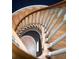 A wooden staircase with white railings at 4705 Paran Nw Vly, Atlanta, GA 30327
