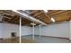 Unfinished basement with concrete floor, white walls, ductwork, and support beams at 1987 Darrell Dr, Marietta, GA 30066