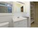 Bathroom includes a vanity with drawers, storage shelving, and updated lighting at 1987 Darrell Dr, Marietta, GA 30066