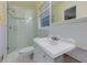 This bright bathroom offers a glass shower surround, updated fixtures, and white subway tile at 1987 Darrell Dr, Marietta, GA 30066