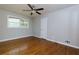 Bedroom with hardwood flooring, modern ceiling fan and window overlooking backyard at 1987 Darrell Dr, Marietta, GA 30066