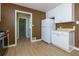 Bright kitchen featuring white cabinets, stainless appliances, and durable wood-look flooring at 1987 Darrell Dr, Marietta, GA 30066