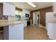 Updated kitchen with white cabinets, stainless steel appliances, and wood-look flooring at 1987 Darrell Dr, Marietta, GA 30066