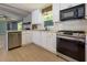 A bright kitchen offers stainless appliances, plenty of cabinetry, and an open floorplan at 1987 Darrell Dr, Marietta, GA 30066