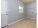 A simple laundry room with tile flooring and storage options at 1987 Darrell Dr, Marietta, GA 30066