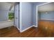 Open-concept living area with hardwood floors, flowing into a carpeted space filled with natural light at 1987 Darrell Dr, Marietta, GA 30066
