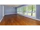 Bright living room with large windows, hardwood floors, and neutral paint, creating an inviting atmosphere at 1987 Darrell Dr, Marietta, GA 30066