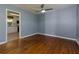 Cozy living room adjacent to the kitchen, featuring hardwood floors and a view of the backyard at 1987 Darrell Dr, Marietta, GA 30066