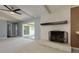 Living room featuring a white brick fireplace, sliding glass doors, and neutral carpeting at 1987 Darrell Dr, Marietta, GA 30066