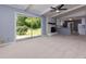 Spacious living room with a sliding door to the backyard, plus a brick fireplace at 1987 Darrell Dr, Marietta, GA 30066