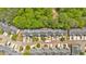 An aerial view of a townhouse community surrounded by lush green trees at 261 Venture Path, Hiram, GA 30141