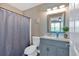 Cozy bathroom boasts a vanity with a sink and a combination bathtub and shower at 261 Venture Path, Hiram, GA 30141