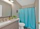 Well-maintained bathroom features a single vanity, toilet, and shower with a curtain at 261 Venture Path, Hiram, GA 30141