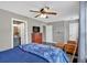 Bright bedroom features neutral walls, wood floors, and comfortable seating area at 261 Venture Path, Hiram, GA 30141