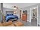 Spacious bedroom with hardwood floors, neutral walls, and a comfortable seating area at 261 Venture Path, Hiram, GA 30141