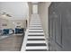 Inviting entryway with stairs, hardwood flooring, and views of the living and dining areas at 261 Venture Path, Hiram, GA 30141