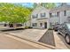 Charming townhome featuring an attractive exterior, front yard, and ample parking space at 261 Venture Path, Hiram, GA 30141