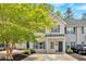 Charming townhome featuring a well-maintained yard and a welcoming front entrance at 261 Venture Path, Hiram, GA 30141