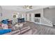 Open-concept living and dining area with modern flooring, neutral walls, and plenty of natural light at 261 Venture Path, Hiram, GA 30141