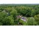 Lush neighborhood with tree-lined streets, showcasing a charming home and serene surroundings with distant city views at 331 Gordon Ne Ave, Atlanta, GA 30307