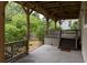 Inviting covered back porch with wood beams overlooking the private backyard at 331 Gordon Ne Ave, Atlanta, GA 30307