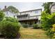 The expansive backyard features a screened in porch and lush landscaping at 331 Gordon Ne Ave, Atlanta, GA 30307