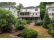 Beautiful backyard featuring a two-story deck, wooden bridge, and stone pathway at 331 Gordon Ne Ave, Atlanta, GA 30307