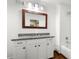 Bright bathroom featuring a granite vanity, framed mirror, and a tiled shower/tub combo at 331 Gordon Ne Ave, Atlanta, GA 30307