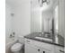 Well-lit bathroom offers a combination tub and shower, vanity with granite countertop, and updated fixtures at 331 Gordon Ne Ave, Atlanta, GA 30307