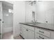 Bright bathroom features a shower/tub combination and updated vanity with a speckled countertop, and updated fixtures at 331 Gordon Ne Ave, Atlanta, GA 30307