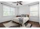 Inviting bedroom with natural light, dark wood flooring, and a comfortable bed, with a ceiling fan overhead at 331 Gordon Ne Ave, Atlanta, GA 30307