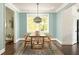 Dining room with hardwood floors and an elegant light fixture at 331 Gordon Ne Ave, Atlanta, GA 30307