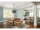 Dining room open to the kitchen, featuring a wooden table and six chairs at 331 Gordon Ne Ave, Atlanta, GA 30307