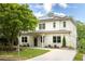 Beautiful two-story home with solar panels, a well-manicured lawn, and mature landscaping at 331 Gordon Ne Ave, Atlanta, GA 30307