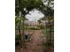 A lush garden path leads through metal trellises and raised garden beds at 331 Gordon Ne Ave, Atlanta, GA 30307