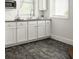 Close up shot of the kitchen, featuring granite countertops, white cabinets, and stainless steel appliances at 331 Gordon Ne Ave, Atlanta, GA 30307