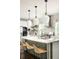 Bright, open kitchen with stainless steel appliances, large island, and pendant lights at 331 Gordon Ne Ave, Atlanta, GA 30307