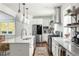 Modern kitchen with stainless steel appliances, stone countertops, and decorative shelving at 331 Gordon Ne Ave, Atlanta, GA 30307