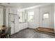 Bright kitchen features white cabinets, stainless appliances, and exterior access door at 331 Gordon Ne Ave, Atlanta, GA 30307
