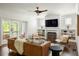 Cozy living room with fireplace, built-in shelving, and access to an outdoor area at 331 Gordon Ne Ave, Atlanta, GA 30307